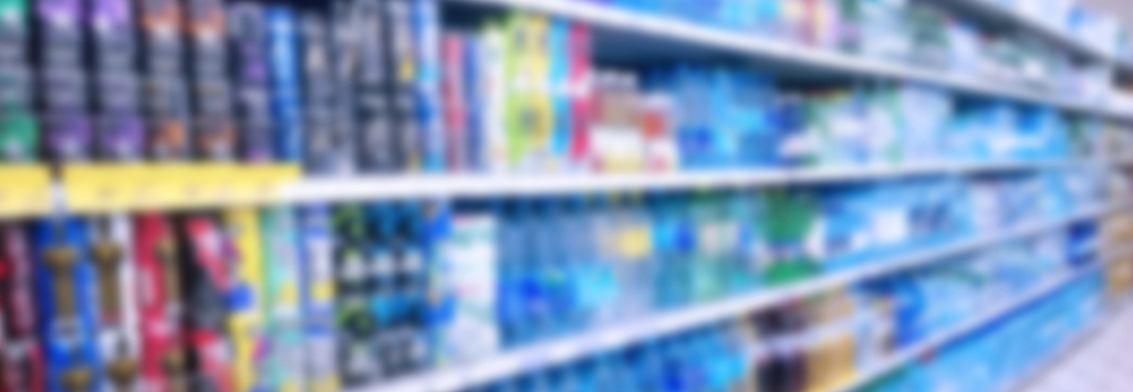 Abstract blur image of supermarket background. Defocused shelves with products.