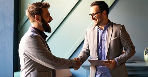 Business people shake hands