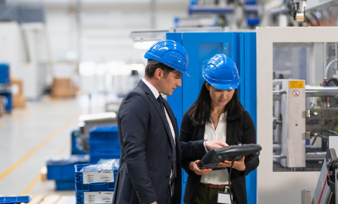 Source - Forbes. Warehouse workers in construction hats